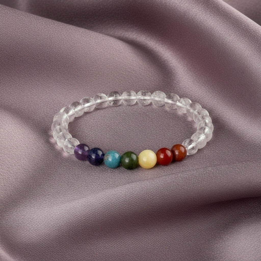 Pulsera "Equilibrio Universal" – Siete Chakras y Cuarzo Cristal Natural (6mm / 8mm)