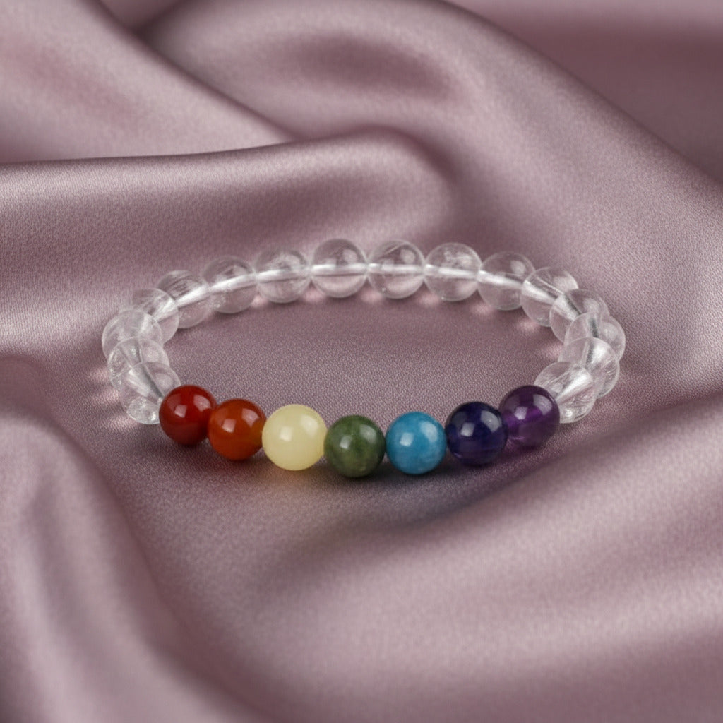 Pulsera "Equilibrio Universal" – Siete Chakras y Cuarzo Cristal Natural (6mm / 8mm)